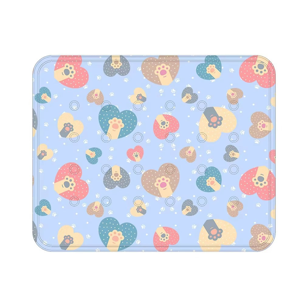 Light blue cooling dog mat with colorful heart shapes and paw prints for summer pet comfort and relief