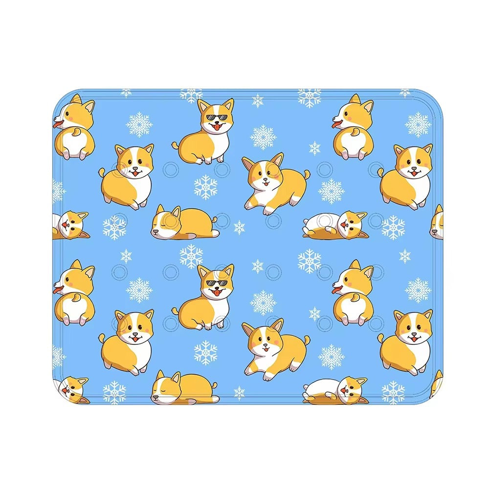 Blue cooling dog mat with cartoon corgi dogs and snowflakes pattern for summer pet comfort.