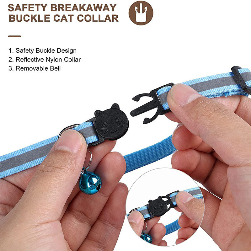 Close-up of a blue reflective cat collar with safety breakaway buckle and removable bell being held in hands
