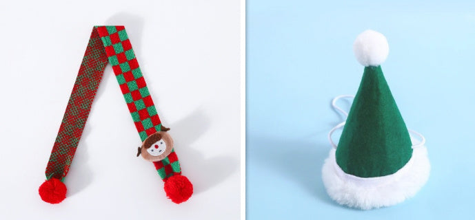 Knitted wool plaid red and green pet scarf with pompom and elf face, and green Santa Claus hat with white trim and pompom.