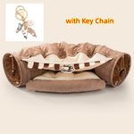 Load image into Gallery viewer, Brown and cream collapsible cat tunnel with soft cushion and hanging mouse toys, includes cat-themed keychain accessory.
