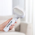 Load image into Gallery viewer, Hand holding a white pet disposable foam magic lint brush removing floating hair from dogs and cats easily
