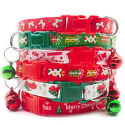 Stack of adjustable holiday pet collars with Christmas-themed patterns and attached jingling bells for dogs and cats