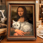 Load image into Gallery viewer, Framed Mona Lisa portrait with a cat lying on her arm, doubling as a funny scratch board and cozy pet bed.
