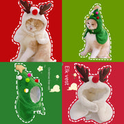 Cat dressed in cozy antler and Christmas tree pet costume vests for holiday or New Year’s celebration