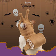 Dog wearing brown cat snail headdress Halloween costume with snail shell and antennae on brown spooky background