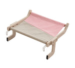 Load image into Gallery viewer, Space-saving cat hanging bed with wooden frame and pink-beige fabric, perfect for window, balcony, or bedside perch.
