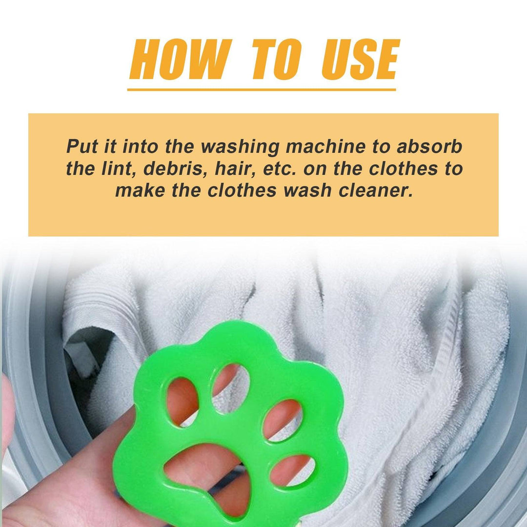 Hand holding green paw-shaped pet hair remover over laundry inside washing machine for lint removal