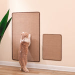Load image into Gallery viewer, Cat scratching two sizes of durable sisal mats mounted on a wall in a clean indoor space

