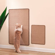Cat scratching two sizes of durable sisal mats mounted on a wall in a clean indoor space