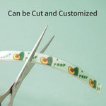 Load image into Gallery viewer, Scissors cutting a customizable flea and tick repellent collar for dogs and cats with avocado design
