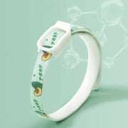 Flea and tick repellent collar for dogs and cats with avocado design and secure buckle on green background.