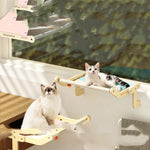 Load image into Gallery viewer, Two cats resting on space-saving hanging beds attached to a window for cozy perch and relaxation
