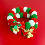 Load image into Gallery viewer, Christmas dog and cat collar with red, green, and white plush balls, red bow, and gold bell holiday pet accessory
