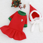 Load image into Gallery viewer, Red and green Christmas dog dress with snowman patch and matching Santa hat with white trim for holiday pets.
