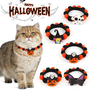 Halloween pet collar with orange and black fur balls and festive pumpkin, skull, and witch accessories for dogs and cats
