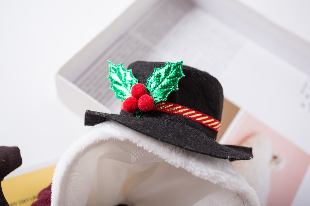 Black snowman hat with red berries and green leaves on white furry Christmas pet costume