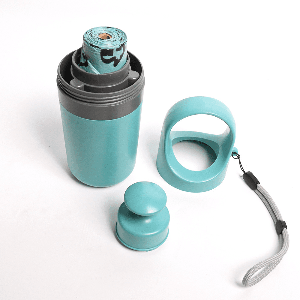 Portable six-claw dog pooper scooper in teal with storage container, dispenser, and carrying handle strap on white background.