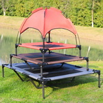 Load image into Gallery viewer, Stacked elevated pet beds with a breathable red canopy for shade and comfort outdoors on grass near water
