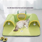Load image into Gallery viewer, Cat resting on a green breathable cat tunnel bed with soft padded ice silk latex surface and playful hanging toys.
