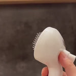 Load and play video in Gallery viewer, Close-up of Self-Cleaning Pet Comb bristles with mist spray nozzle, designed for easy detangling and static reduction during grooming.
