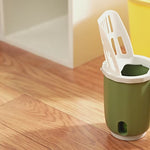 Load and play video in Gallery viewer, Green cat litter scoop and waste bin placed on wooden floor, showcasing compact and stylish design for modern pet care spaces.
