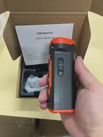 Load and play video in Gallery viewer, Rechargeable ultrasonic dog deterrent with LED flashlight, shown with packaging and user manual for easy setup and training use.
